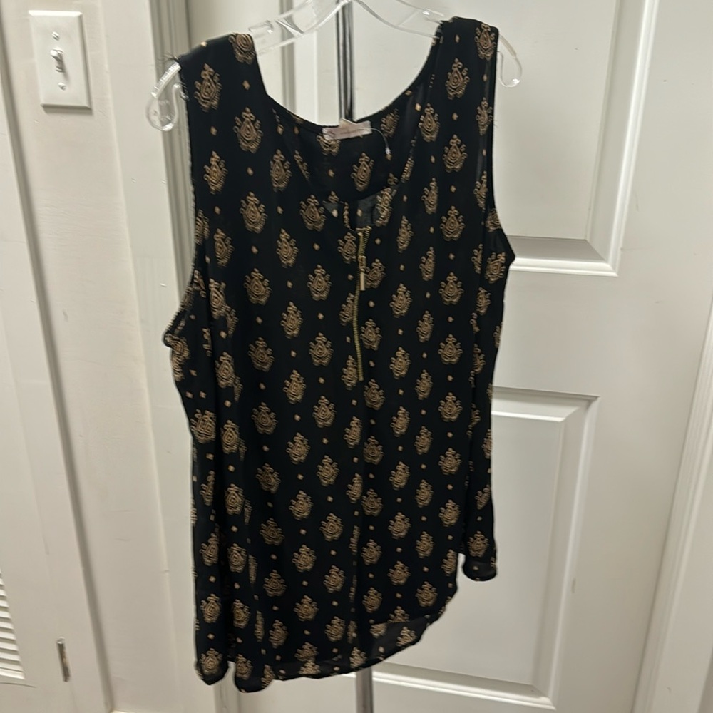 Black sleeveless top with gold design
